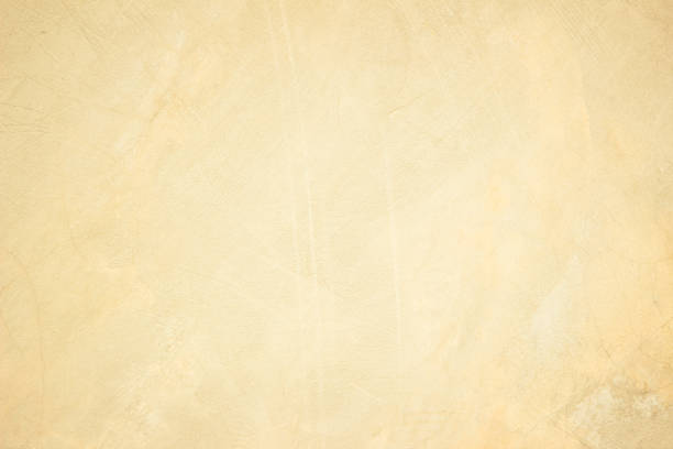istock Old concrete wall texture background. Close up retro plain cream color cement material surface rough for show or advertise promote product content on display and brown paper design element concept. 1400379297