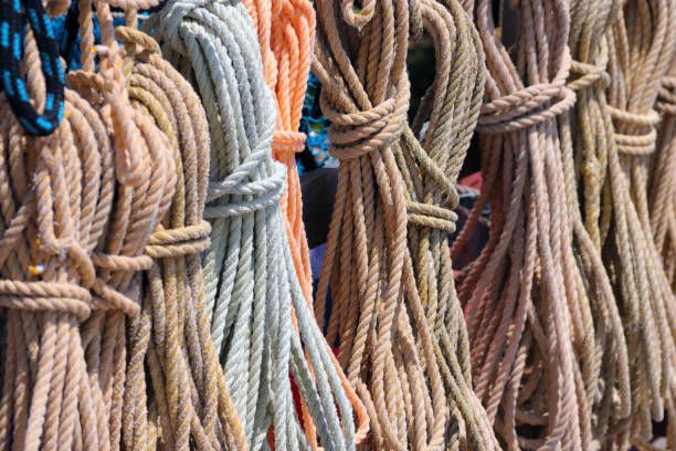 istock Colorful Bundled rope hanging in the harbor. 1400382838