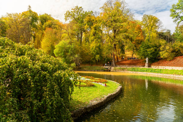 istock Autumn garden trees with yellow leaves 1400384372