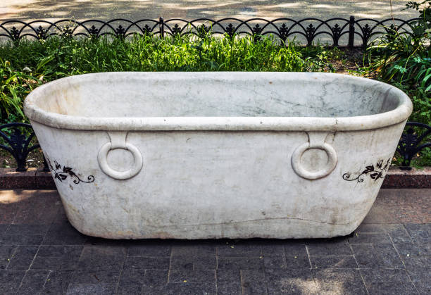 istock White vintage bath in the green park. 1400384416