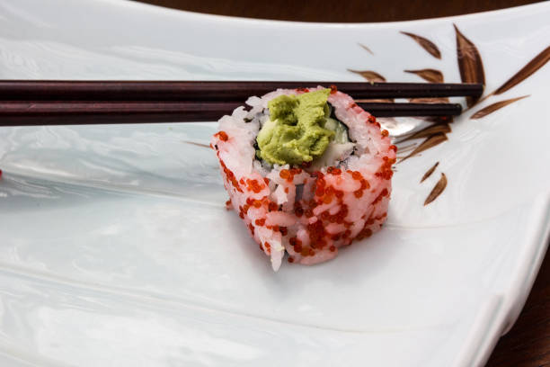 sushi caviar roll and sticks on the plate