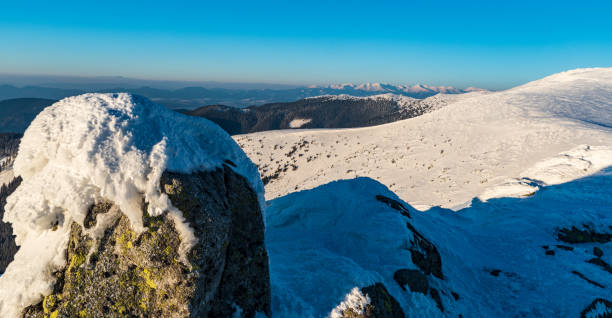 Zapadne Tatry from Durkova hill in winter Nizke Tatry mountains in Slovakia Nearest hills of Nizke Tatry, mountain peaks of Zapadne Tatry and lower hills of Chocske vrchy mountains from Durkova hill in winter Nizke Tatry mountains in Slovakia durkova stock pictures, royalty-free photos & images