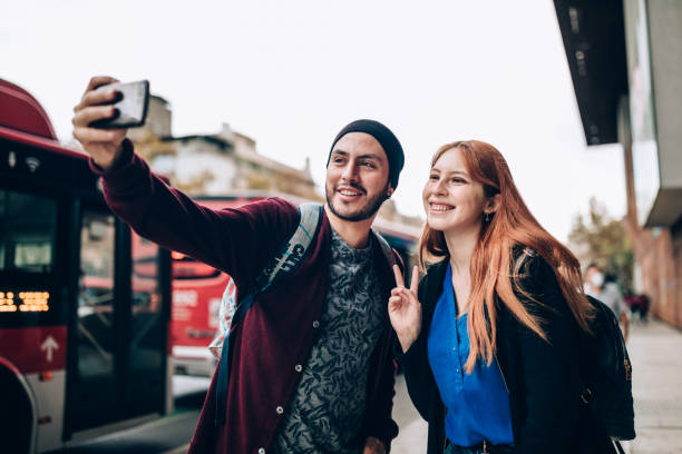 istock Young couple taking a selfie on the streets 1400390336