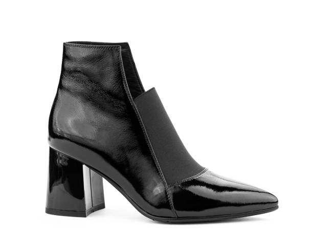 istock Women's autumn ankle black leather boots with black zip and average heels, isolated white background. Right side view. Fashion shoes 1400390371