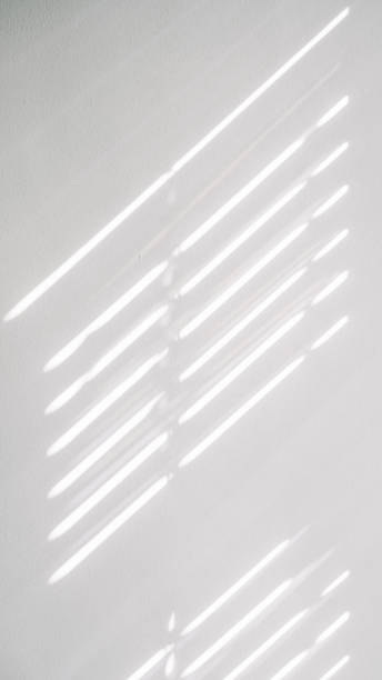 istock Lights shadows. Abstract light, black shadow overlay from window on white texture wall. Sunlight architecture background. Textures Light reflection from the window. 1400390447