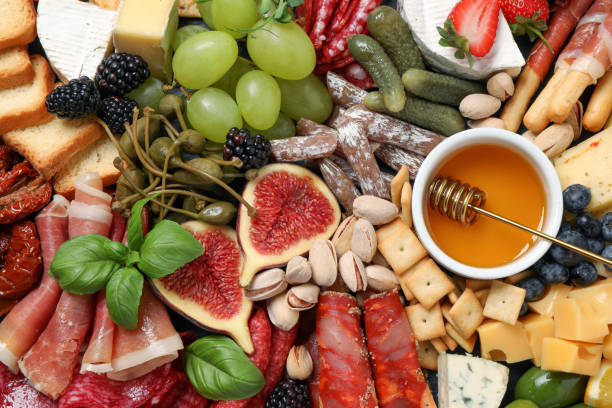 istock Set of different delicious appetizers as background, top view 1400390579