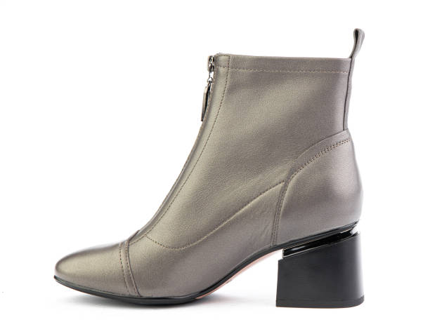 istock Women's autumn ankle grey leather boots with zip and average heels, isolated white background. Left side view. Fashion shoes 1400390626