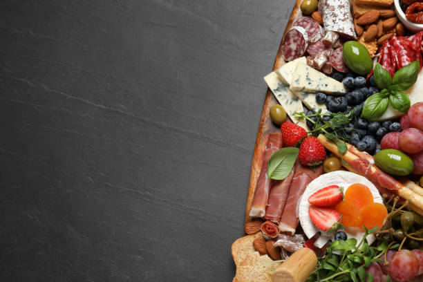 istock Set of different delicious appetizers served on black table, top view. Space for text 1400390743