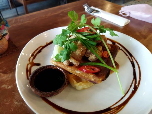 istock Fried chicken with waffle use maple sauce and sesame glaze and asian greens 1400390942