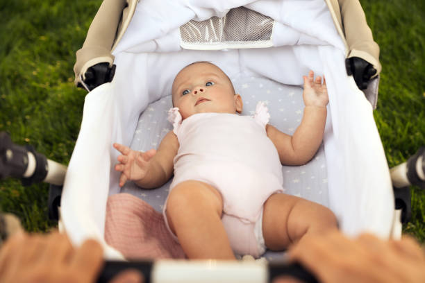 istock Mother with baby in stroller outdoors, closeup 1400390951