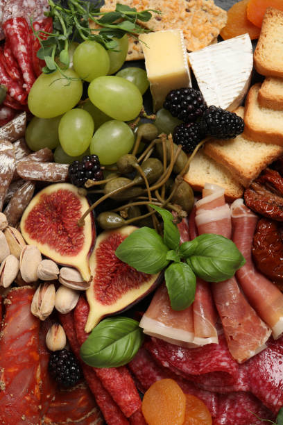 istock Set of different delicious appetizers as background, top view 1400391040