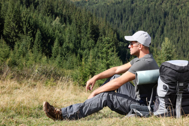 istock Tourist with backpack in mountains on sunny day. Space for text 1400391522