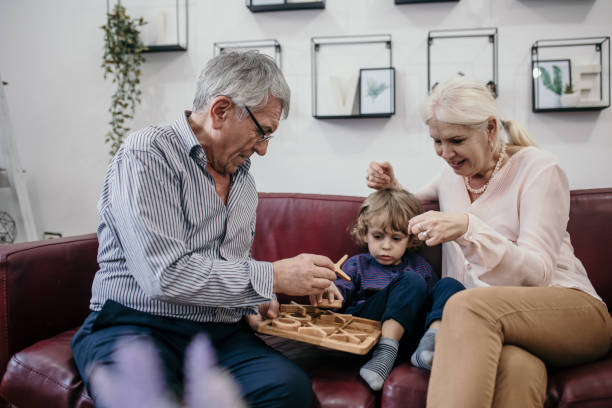 istock Grandparents playing with grandson 1400392686