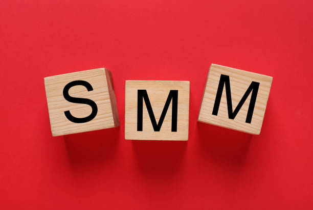 istock Cubes with abbreviation SMM (Social media marketing) on red background, flat lay 1400393880