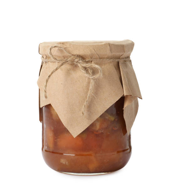 istock Tasty apple jam in glass jar isolated on white 1400393937