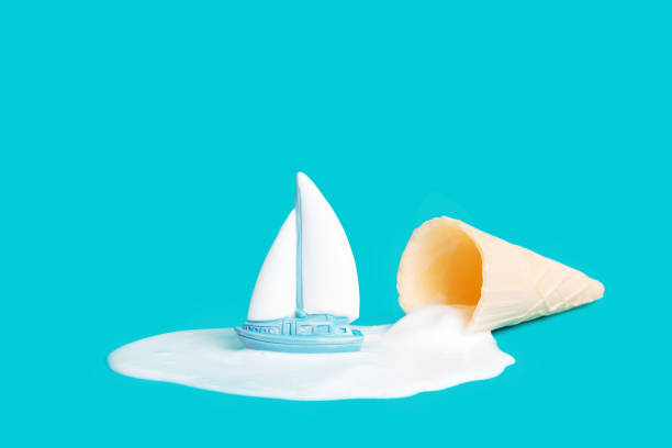istock Ship cruising the melted ice cream puddle on blue 1400399201