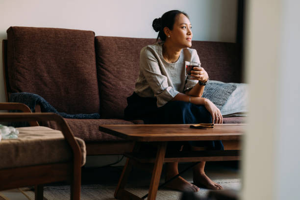 istock Asian Woman Relaxing At Home 1400400367