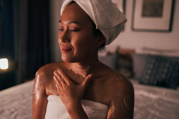 istock Asian Woman Applying Cream 1400400426