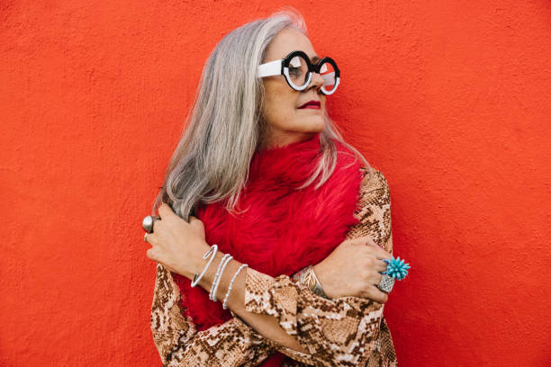 istock Stylish elderly woman looking away thoughtfully 1400400837