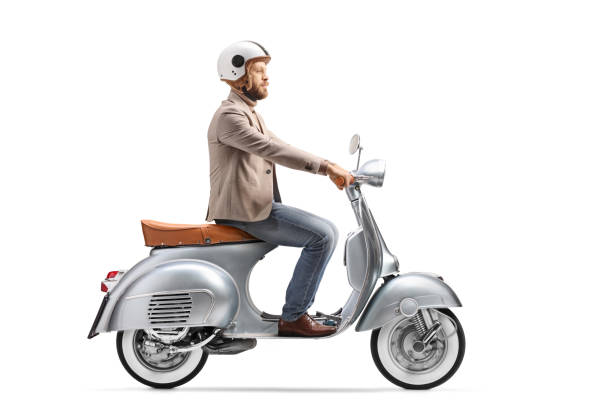 istock Young man with a helmet riding a vintage scooter 1400403504