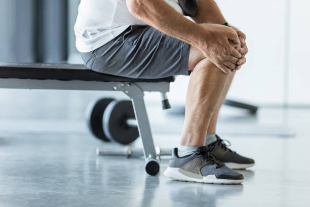 istock Active senior in gym with knee injury 1400403506