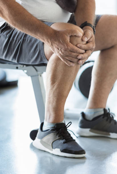 istock Active senior in gym with knee injury 1400403550