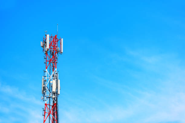 istock Telecommunication tower with signal repeater antennas against blue sky 1400403897