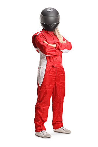 Female racer in a red suit and black helmet posing isolated on white background