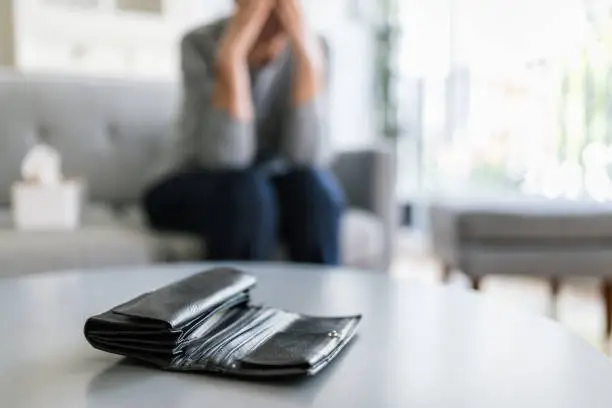 Desperate elderly woman unhappy with the rising cost of living