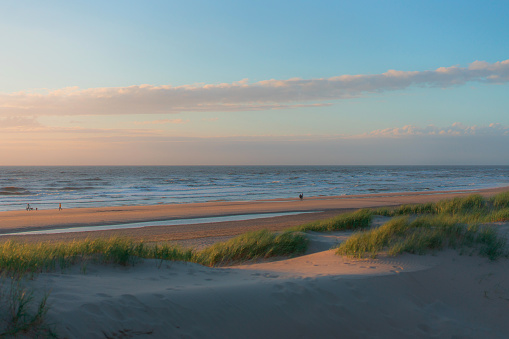 Scenic view of beach in Katwijk aan Zee at sunset  in summer