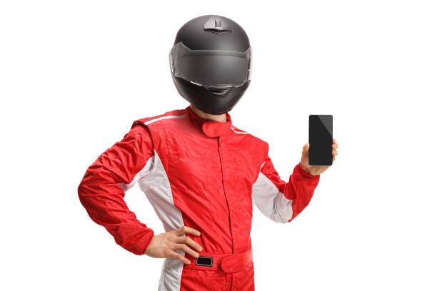 istock Car racer with a helmet holding a smartphone 1400406724