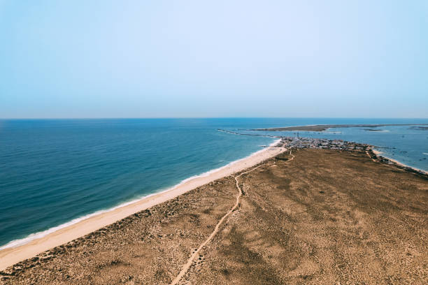 istock Empty sandy beach near wavy sea 1400407455