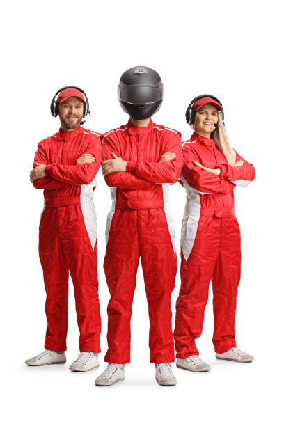 istock Racing team members and a racer with a helmet posing 1400407518