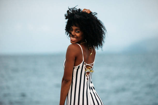 istock Woman in a volcanic beach 1400407815