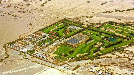 Nevada, CA / USA - August 12, 2021: Aerial view of Furnace Creek Golf Course at Death Valley, Nevada, California, USA.\n\nThe Furnace Creek Golf Course at Death Valley is the world's lowest elevation golf course.