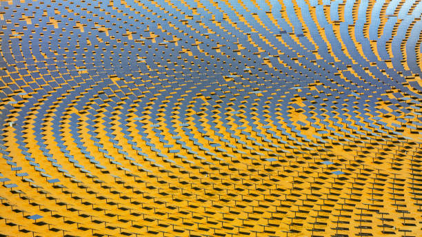 Nevada, CA / USA - August 12, 2021: Aerial view of large solar thermal power plant farm in Crescent Dunes Solar Energy near Tonopah, Nevada, California, USA.The Crescent Dunes Solar Energy Project is a concentrating solar power plant built near Tonopah in Nye County, Nevada, US. The project began in August 2011 and was completed by early 2014. Commercial operations began in September 2015.