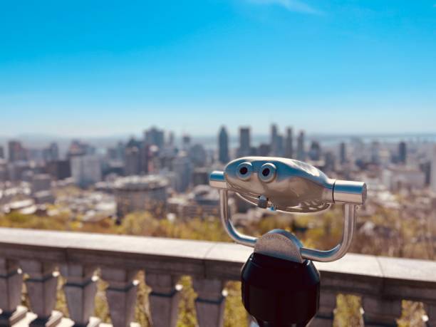 Sightseeing binoculars with Panoramic view of the city of Turin (Torino) and Po river. Mole Antonelliana and Alps mountains on background. Piedmont, Italy