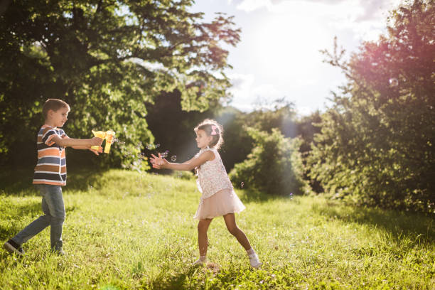istock Beautiful children having fun in nature 1400413864