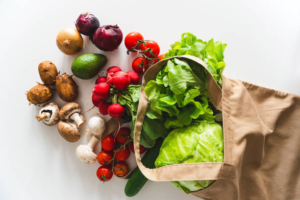 istock Eco friendly natural textile bag with organic vegetables. Top view 1400415074