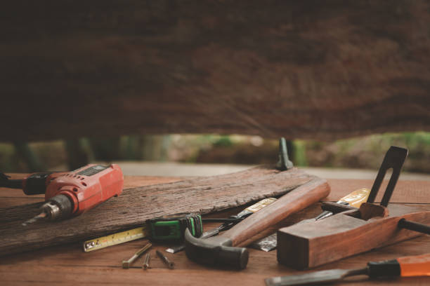 istock carpentry and woodwork tools on wooden background, capenter working table, Vintage. 1400420378
