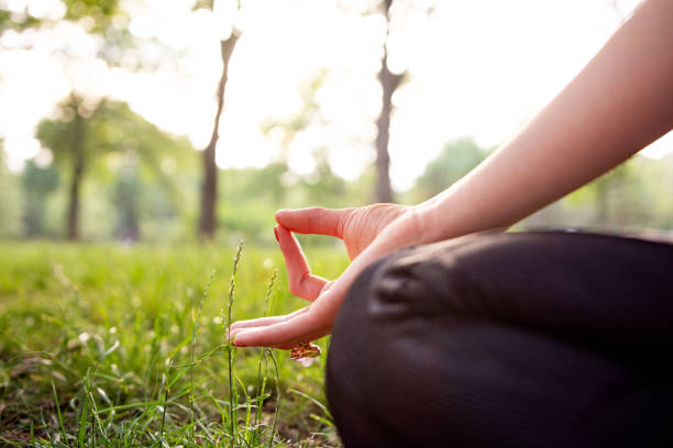 istock Close up woman meditating in nature 1400420385