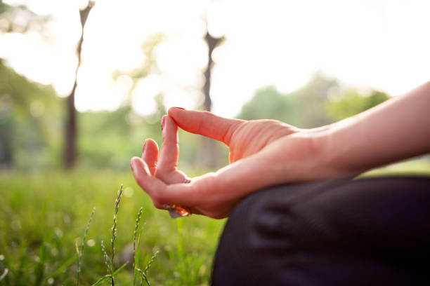 istock Close up woman meditating in nature 1400420389
