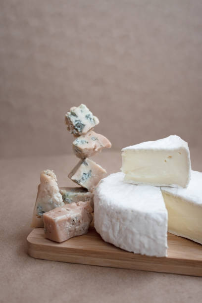 istock blue cheese and hard cheese on a wooden board 1400420734