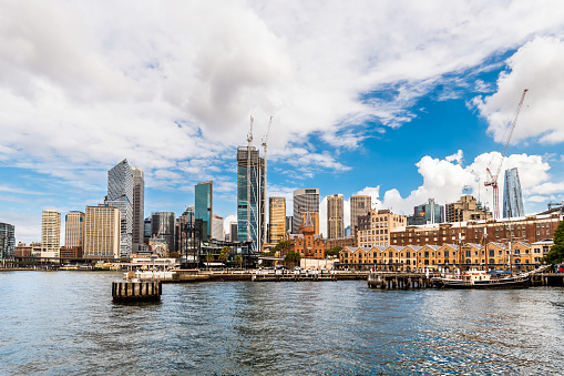 Sydney City, Australia - April 16, 2022: Sydney central business district and Circular Quay viewed through Campbells Cove from Hickson Road Reserve on a day