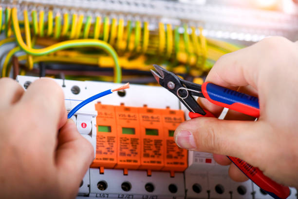 istock Electrician cutting wires detail. 1400420925