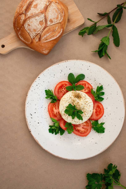 istock burrata cheese with tomato and herbs on a plate 1400422739