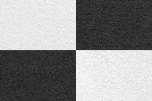 istock Texture of craft black and white paper background with cells pattern, macro. Structure of vintage dense kraft cardboard. 1400423935