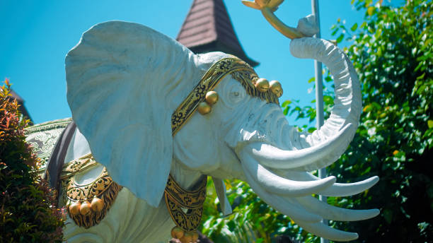 istock Buddhism religious large white elephant statue with gold clothing 1400424389