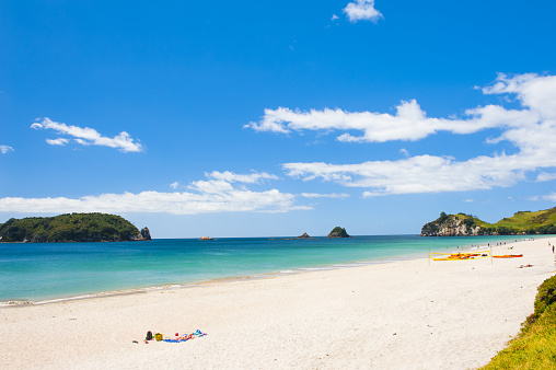 Photo of a beautiful white sand Hahei beach at Cathedral Cove Marine Reserve, Coromandel Peninsula, New Zealand.