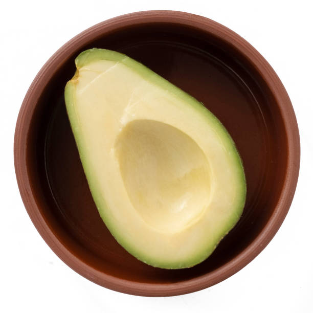 Avocado cut in half in a bowl